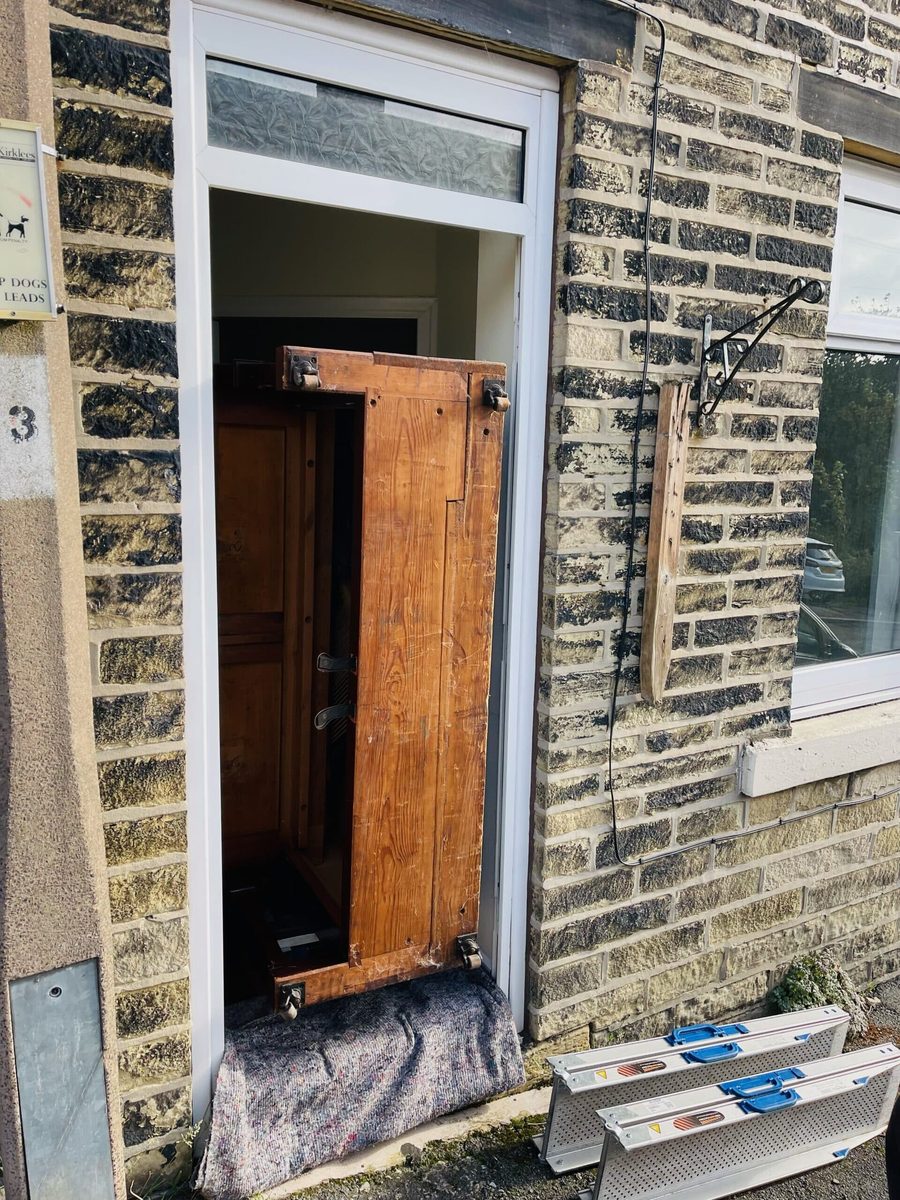 Upright piano being moved in the Leeds area