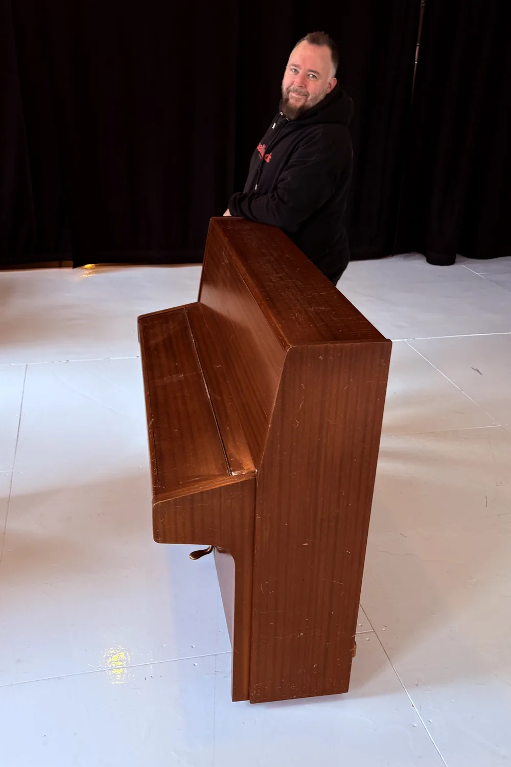 Upright piano prepared for moving